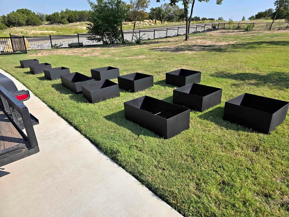 Close-up of curved steel planter with seating detail